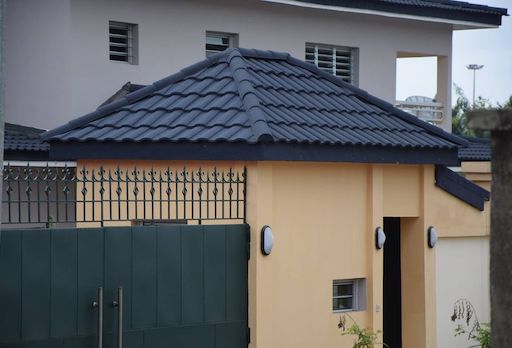 Colored stone metal tile gatehouse