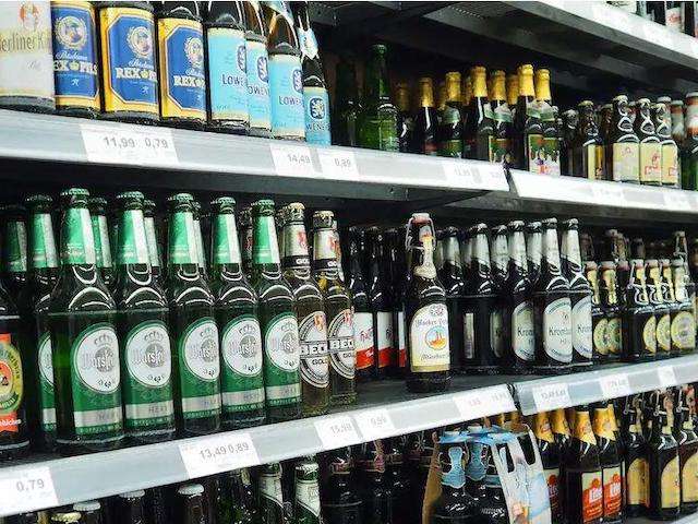 Assorted beer bottles on shelf