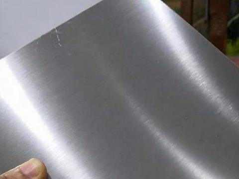 Macro view of grain direction on a brushed No.4 marine grade stainless steel sheet