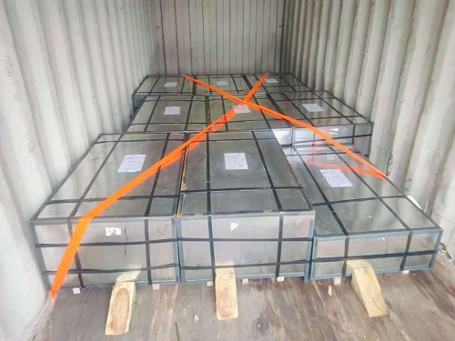 Workers loading TFS coils into a shipping container bound for Bolivia